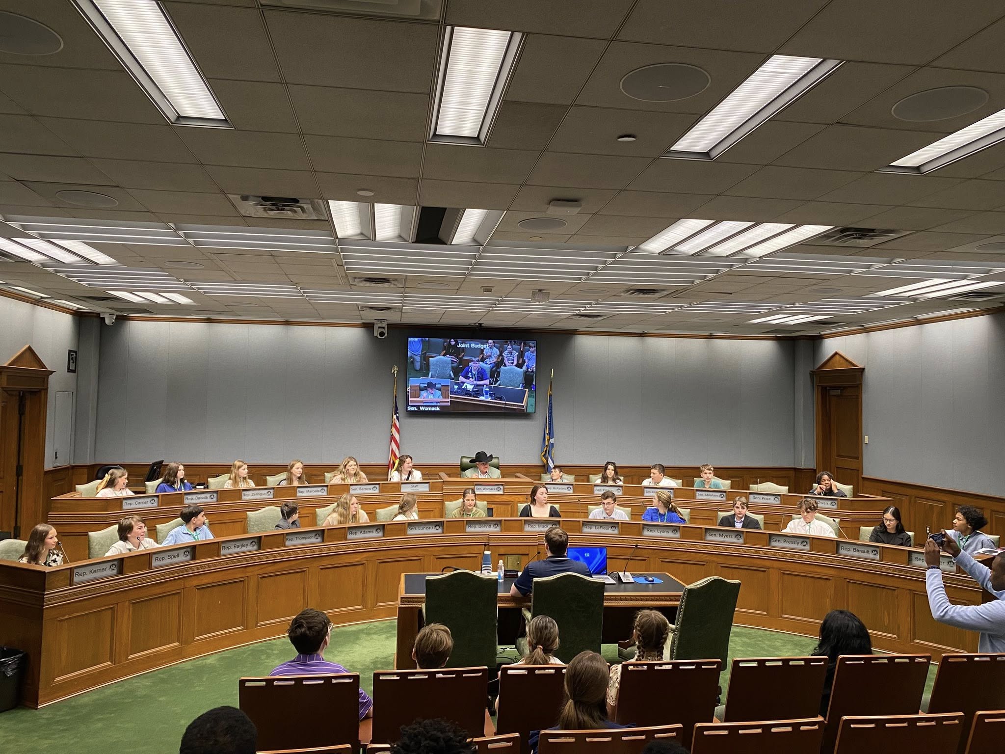 A group of people in a conference room.